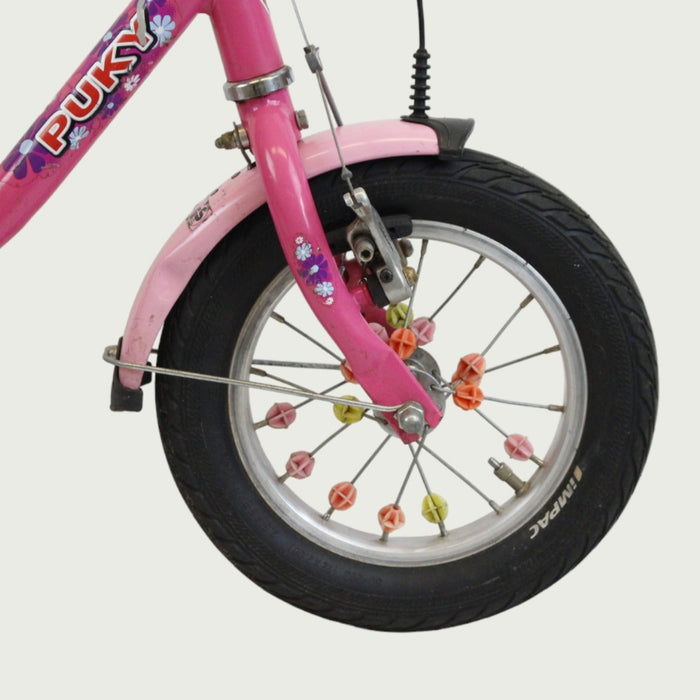 12.134 - BikeFlip, 12 inch kinderfiets, Puky fiets, roze kinderfiets, spaak kraaltjes, terugtraprem, handrem, kabelslot